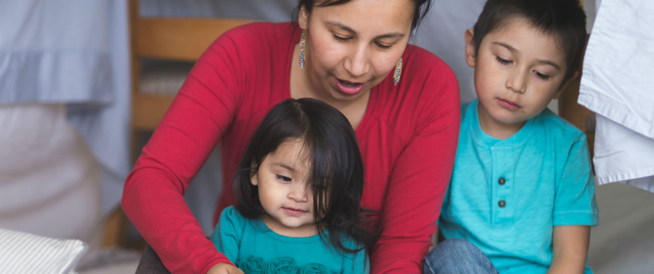 woman reading to her kids